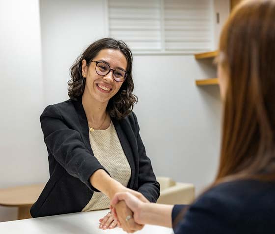 Two ladies greeting each other