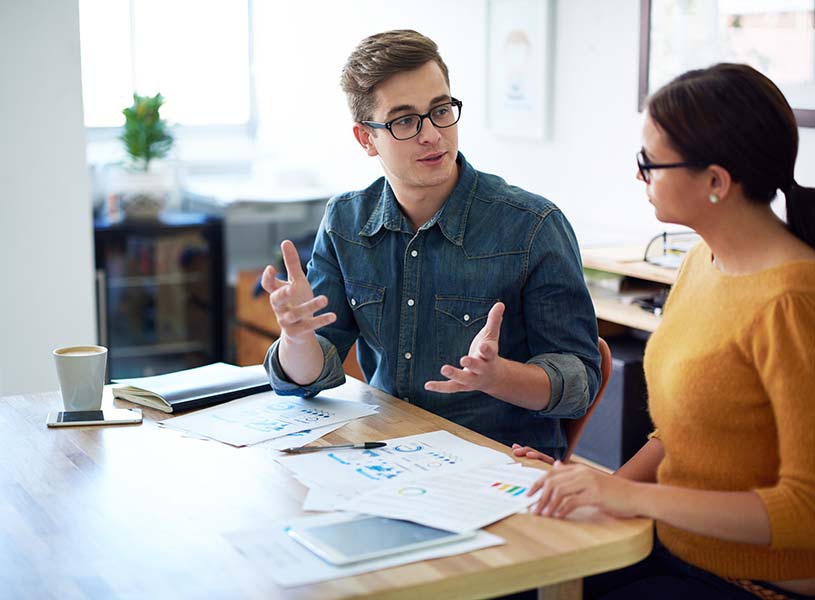 Coworkers having a discussion in an office